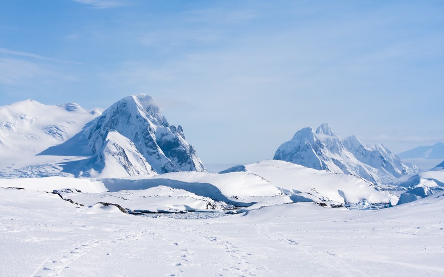 Mountain range is covered with white snow in Antarctica